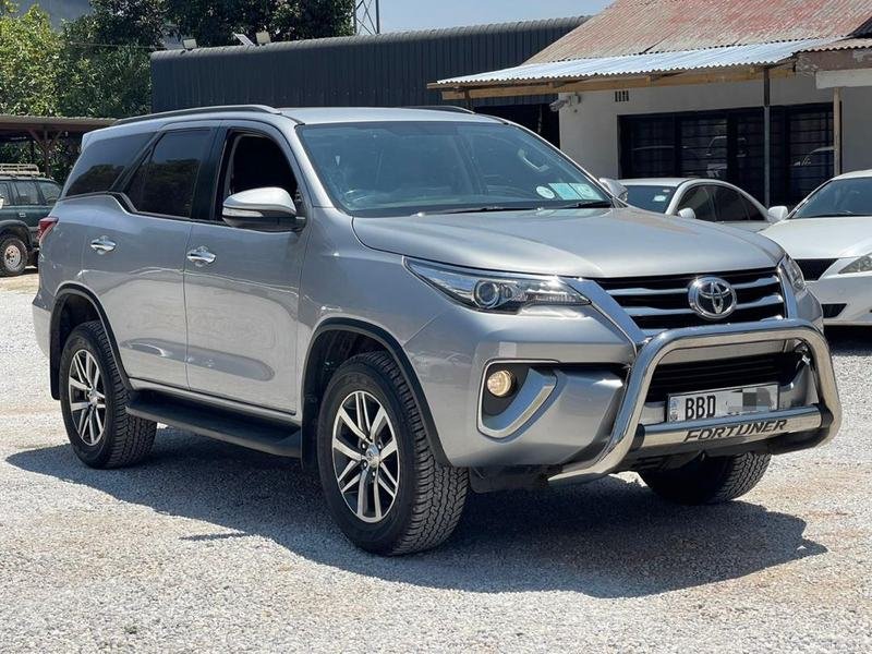 A silver Toyota Fortuner from the Local Legends fleet, parked in Lusaka